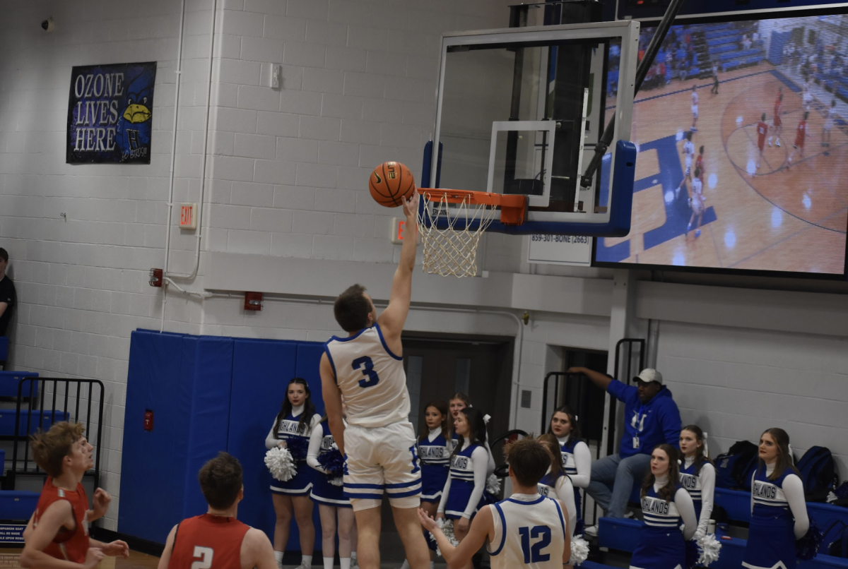 Vinny Listerman (11) shoots the ball after a steal. “I started off pretty slow. But as the game got going we all started to not play very well, I decided that we needed to step up our game and turn up the intensity of how we played,” Listerman said.